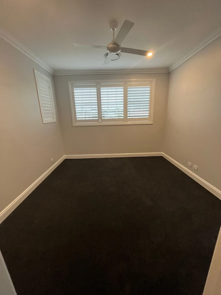 Bedroom with plantation shutters